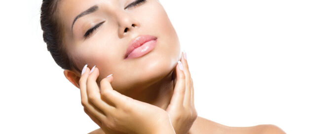 Woman touching her smooth face