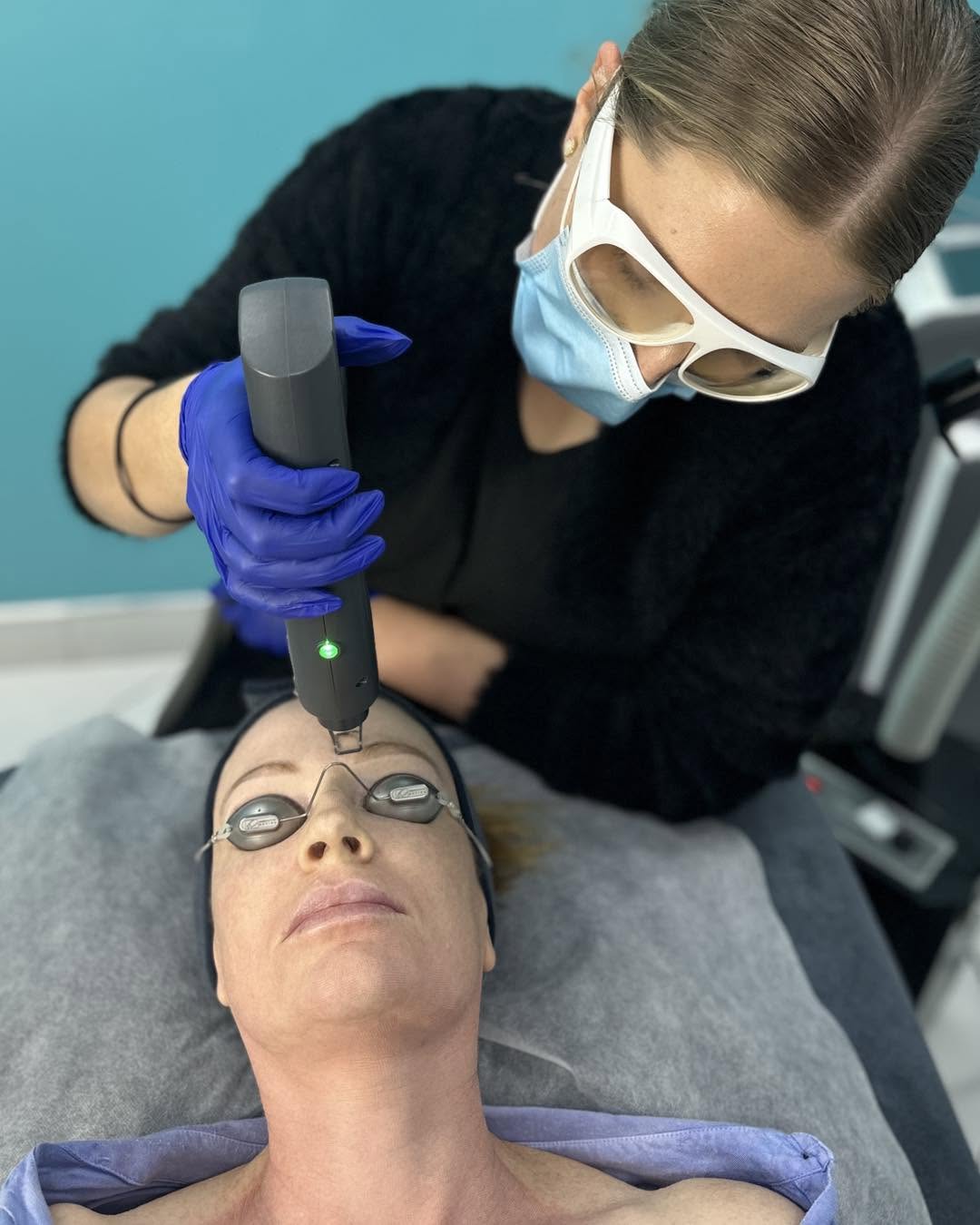 Woman undergoing hollywood laser facial treatment