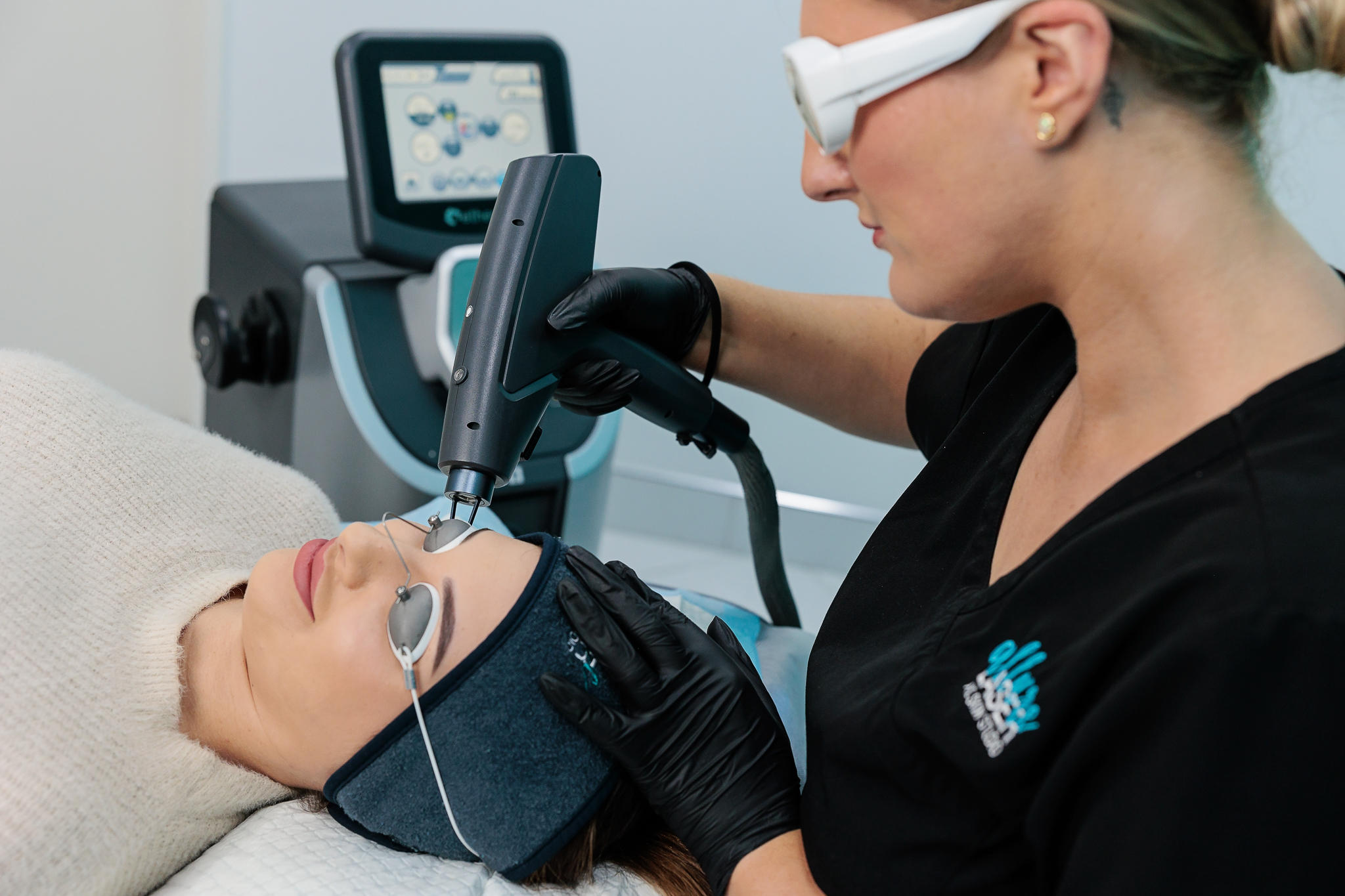 Woman undergoing 2940 fractional laser treatment