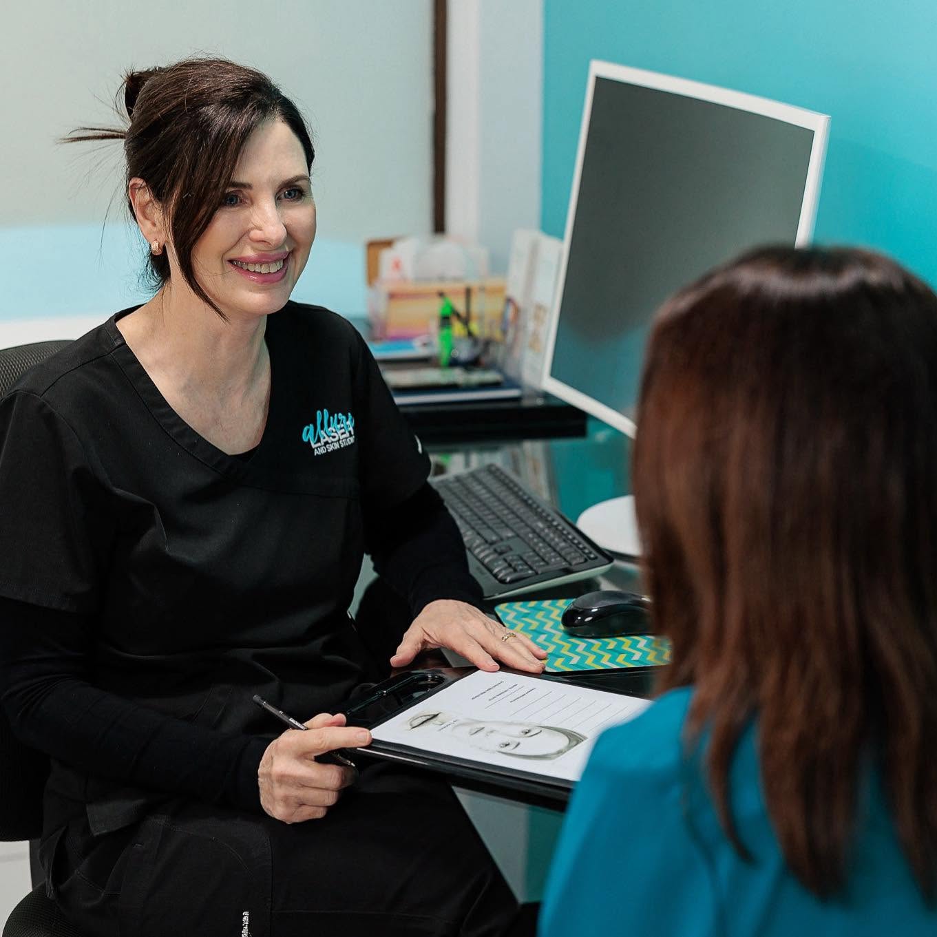 Clinic staff talking to the customer