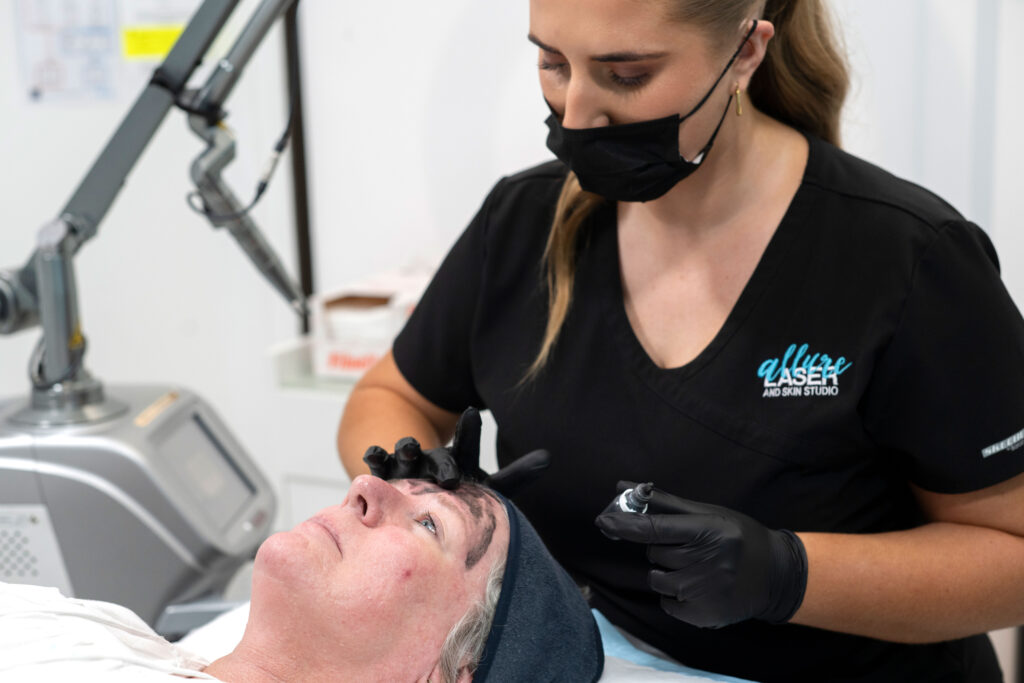 Woman undergoing laser skin rejuvenation treatment