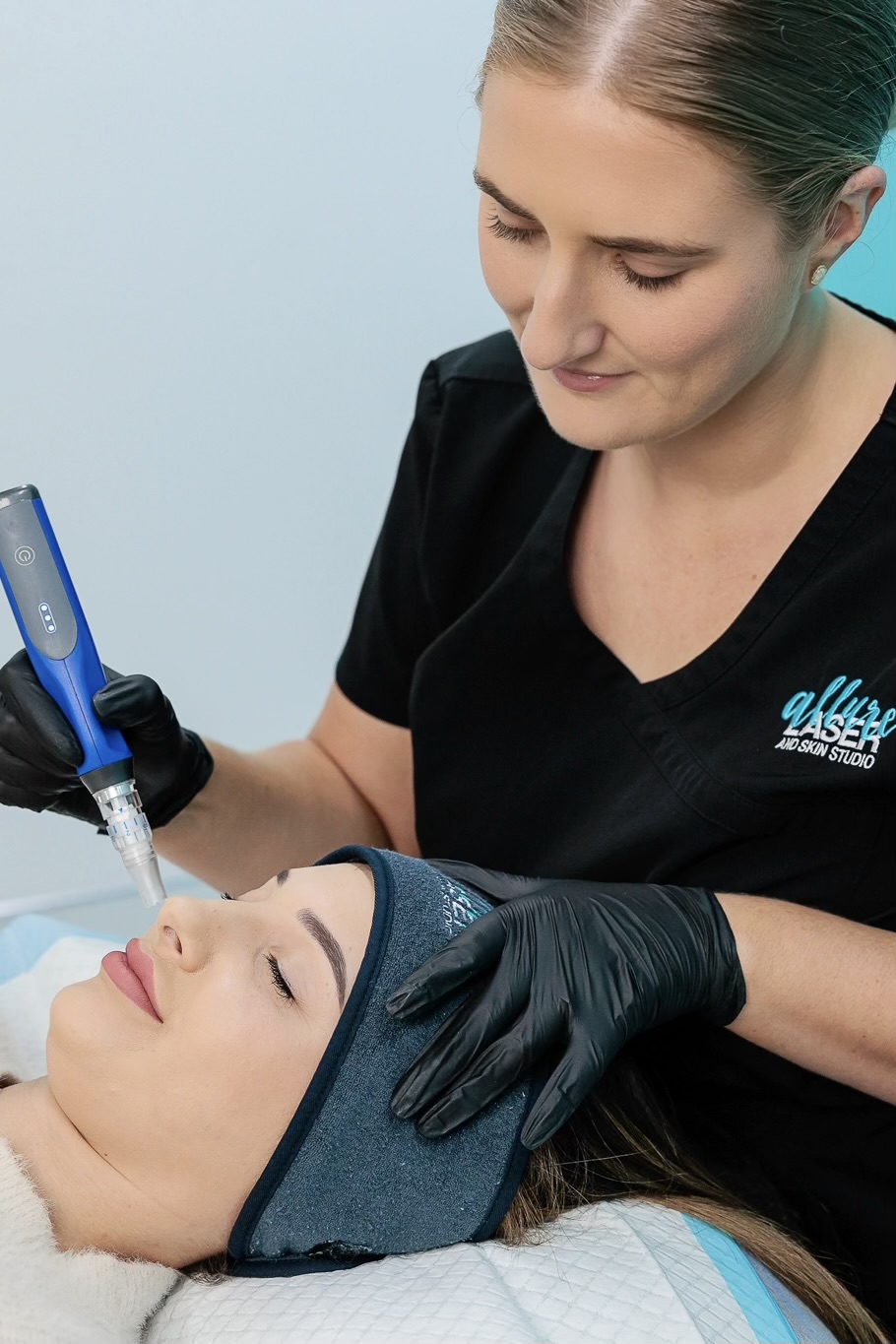Woman receiving a microneedling treatment