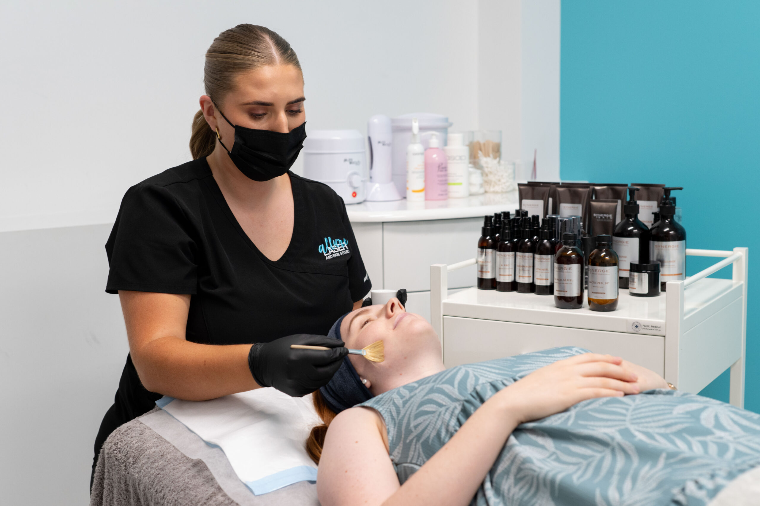 Woman receiving a chemical peel treatment