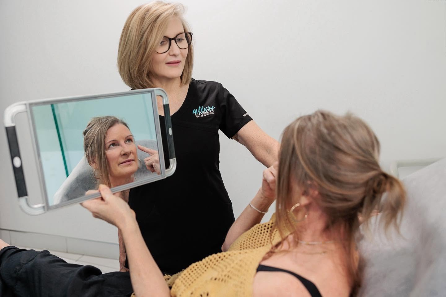 Woman receiving a facial ageing treatment